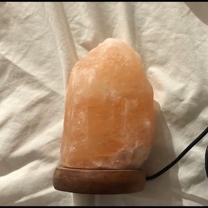 Himalayan salt lamp with wooden base